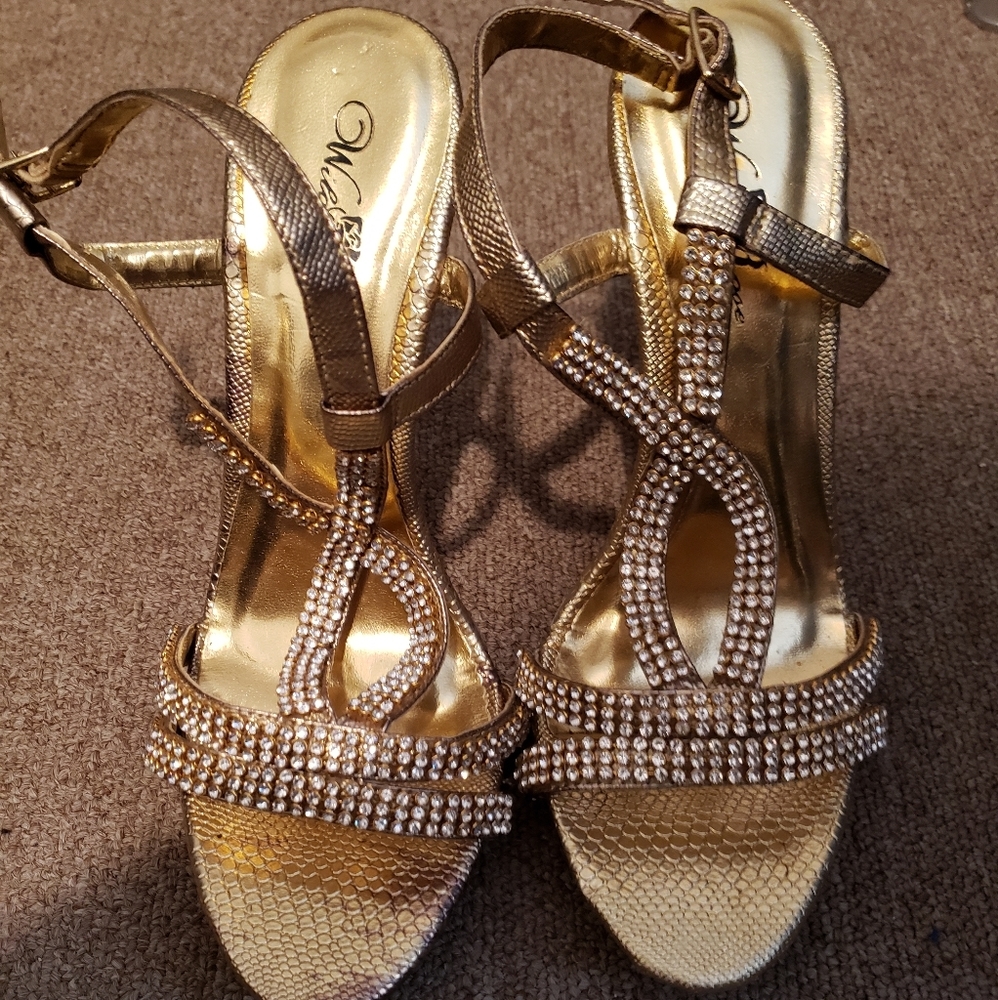 Beautiful gold open toe heels.
